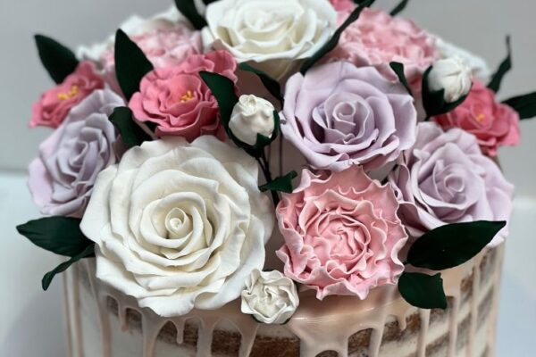 Naked cake with fresh flowers on top